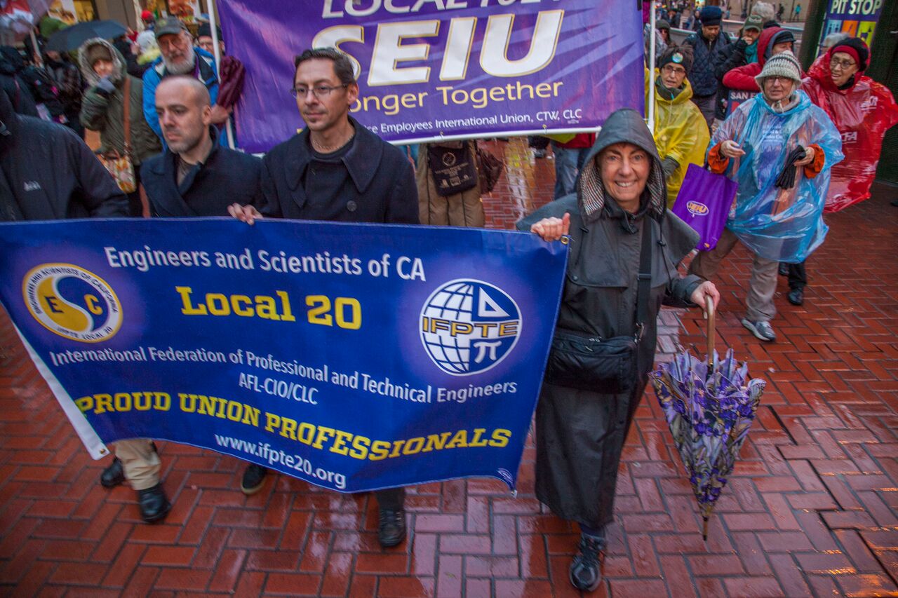 Kathy Setian and other members of IFPTE Local 20 march at the Inauguration protest on January 20th in San Francisco.
