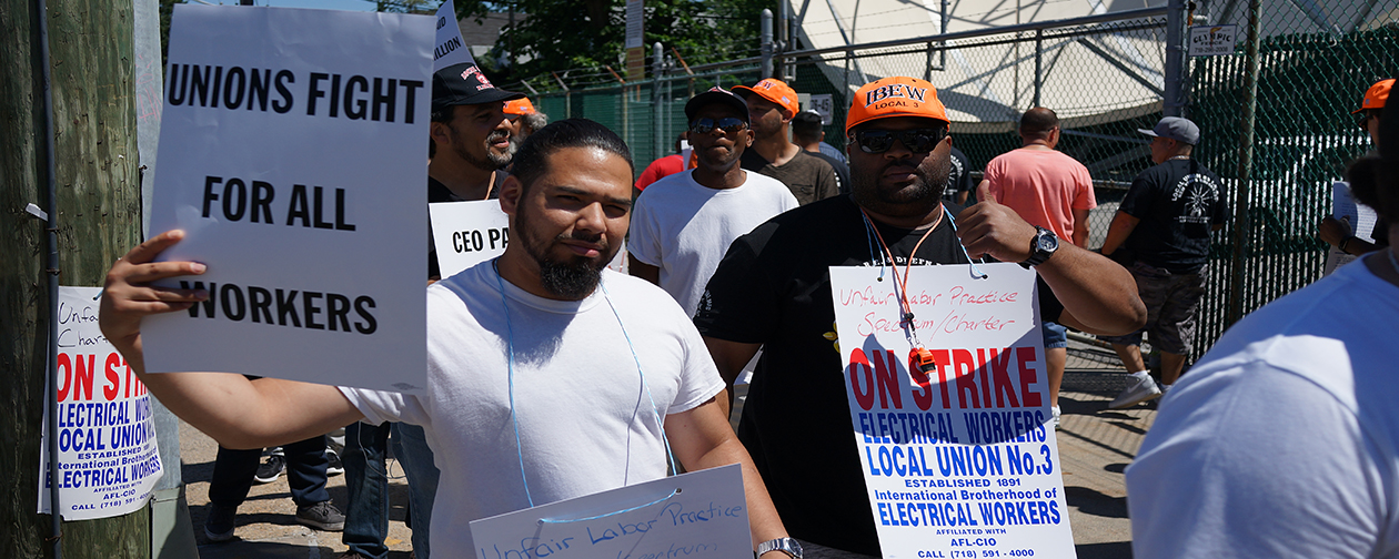 New York Local 3 members picketed outside a Charter/Spectrum facility in Queens on June 27. They have been on strike against the company for more than three months.