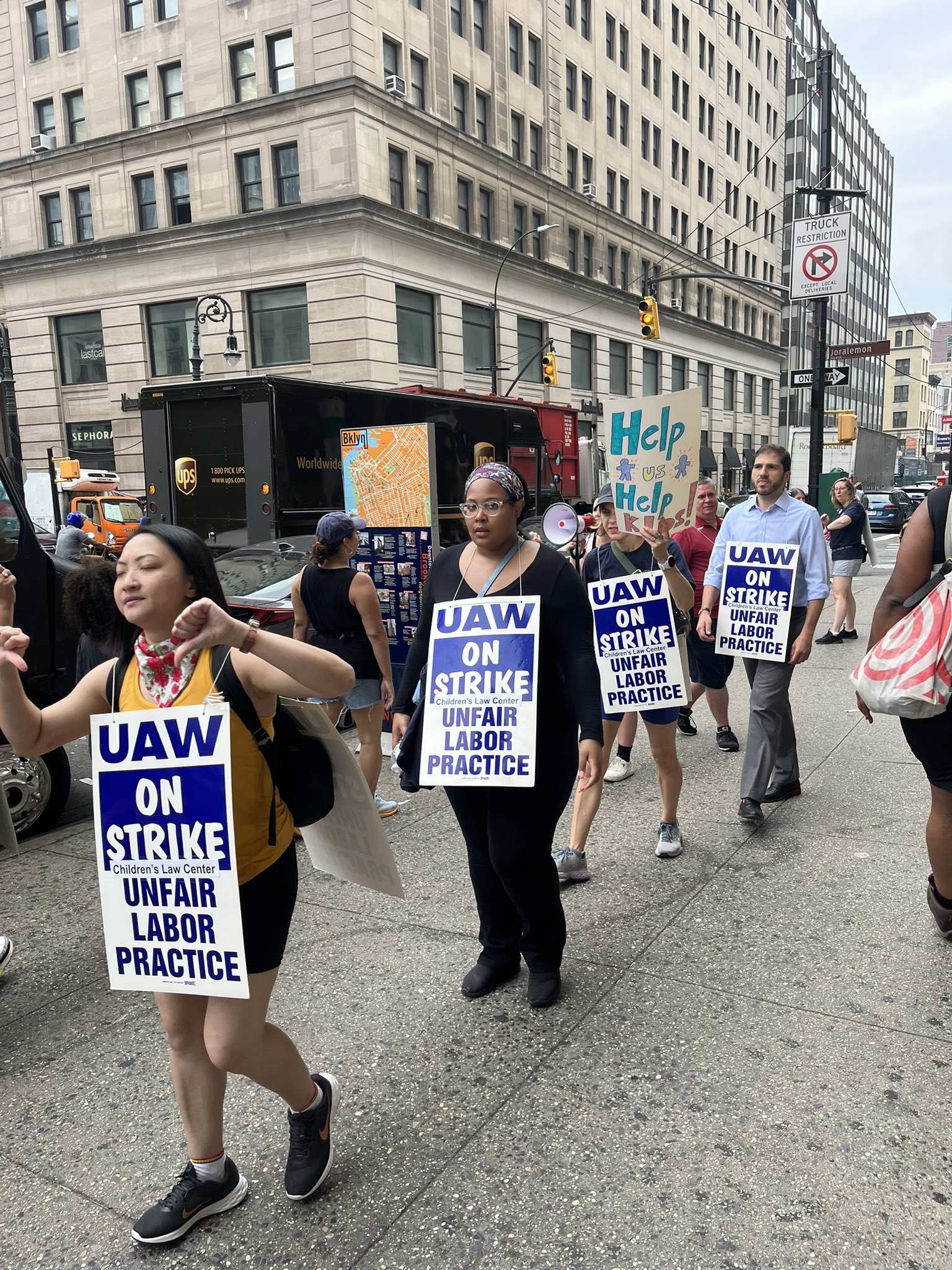 Children's Law Center workers (UAW) strike so they can better help children.