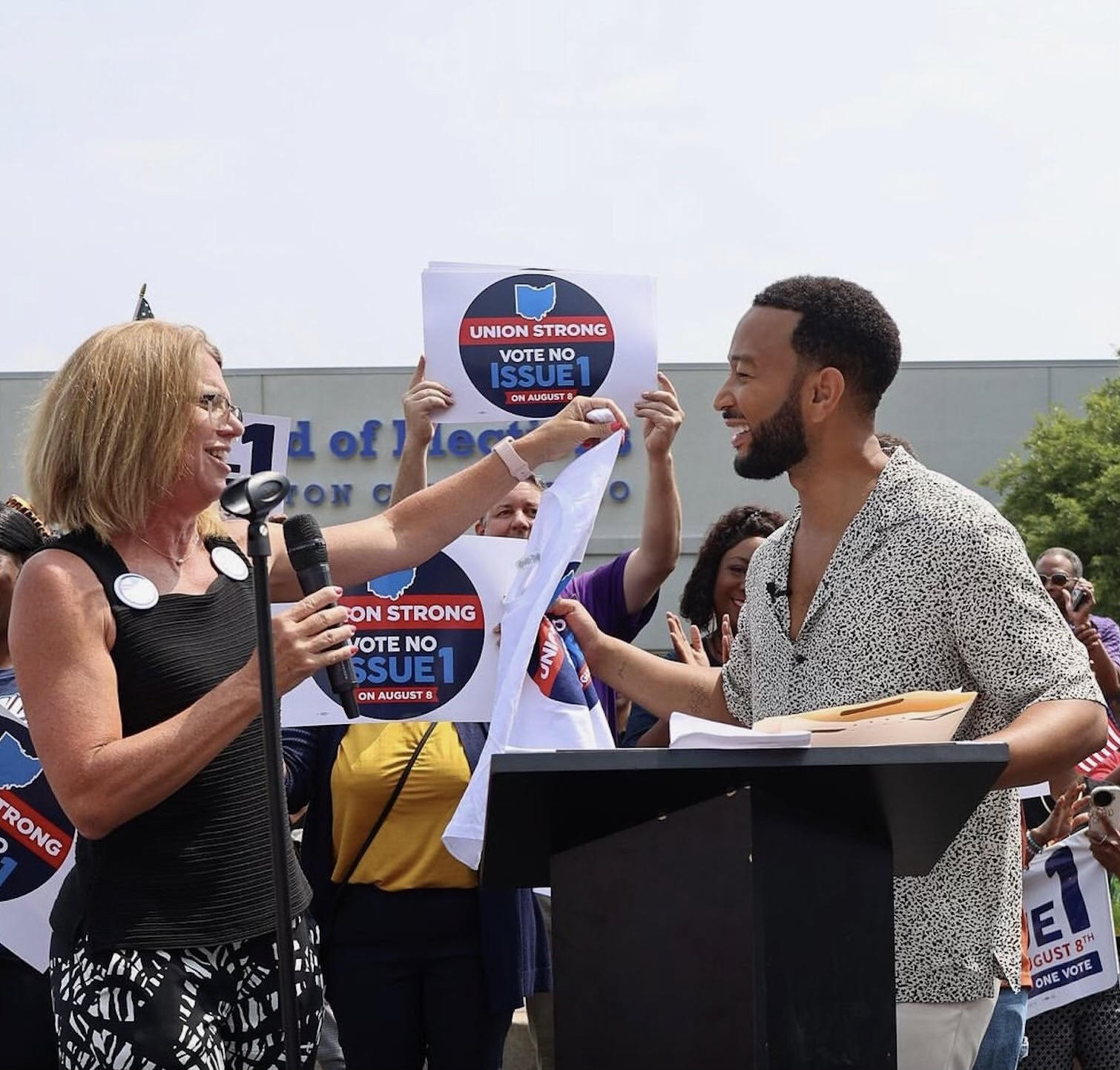 Melissa Cropper (AFT), secretary-treasurer of the Ohio AFL-CIO and president of the Ohio Federation of Teachers, rallies with singer-songwriter John Legend (AFM) in Cincinnati to urge a no vote on Issue 1. 