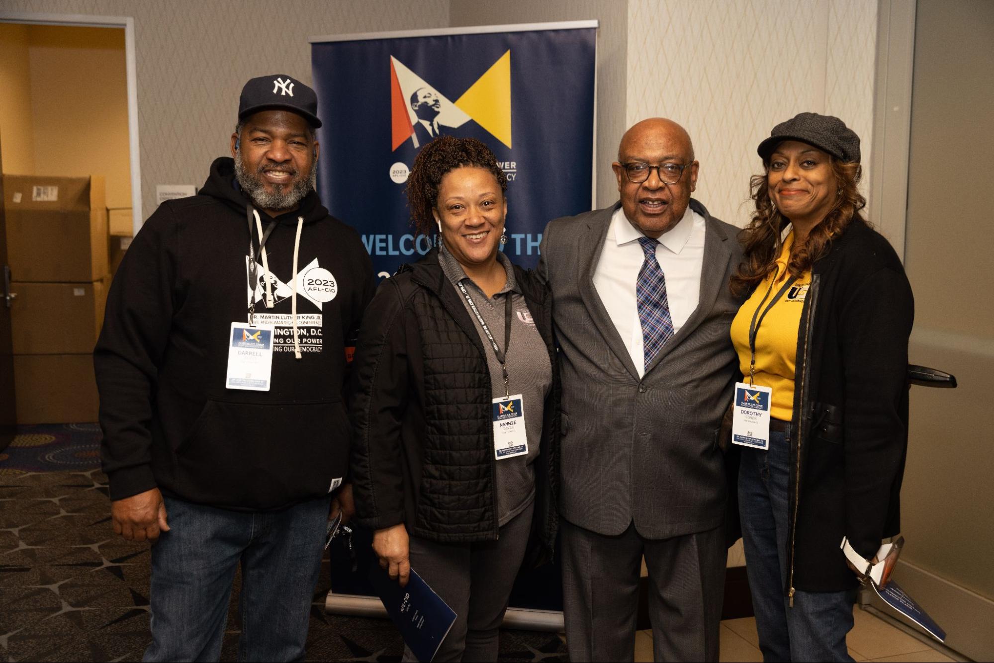 AFL-CIO Secretary-Treasurer Fred Redmond (second from right) greets union members.