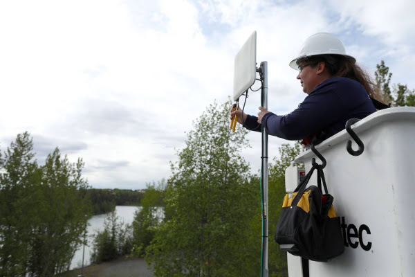 Kristin Barber, an IBEW Local 1547 member in Anchorage, Alaska, delivers broadband services in Sterling.