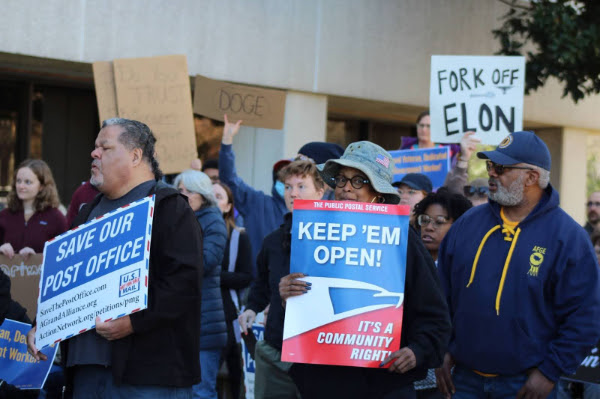 Workers at a rally to protect the USPS.