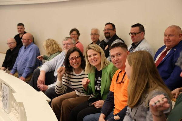 AFL-CIO President Liz Shuler (green blazer) in the Vermont State House.